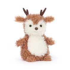 a brown and white stuffed animal with antlers on it's head, sitting in front of a white background