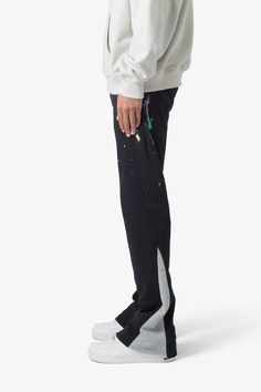 the Contrast Bootcut Sweatpants are designed with a relaxed fit throughout, featuring an elasticized self waist and leg opening, multi-colored paint splatter throughout, and finished with denim and contrasting panels at the inseam and outseam to provide a flare at the leg opening. details relaxed fit flared leg opening 55% cotton 45% polyester model is 6’1, 140 lbs and wears a size medium Bootcut Sweatpants, Layered Hoodie, 140 Lbs, Fuzzy Cardigan, Baggy Trousers, Denim Patches, Denim Flares, Paint Splatter, Black Coat