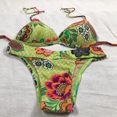 Brazilian Bright Floral Print Bikini Set. Bright Multi Flowers Design With Light Padding White Bikini Top With Bright Floral Print Straps And Floral Design On Cups And Bright Wide Band Floral Bikini Bottom. Sexy Tropical Bikini Set. Made In Brazil. A56-529 #Brazilianbikini #Bikini #Swimsuit #Brightfloralbikini #Tropicalbikini Navy Blue Bikinis, Tropical Bikinis, Strapless Swimsuit, Yellow Swimsuits, White Bikinis, Flowers Design, Cute Swimsuits, Cheeky Bikinis, Brazil