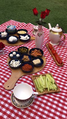 a table topped with plates and bowls filled with food