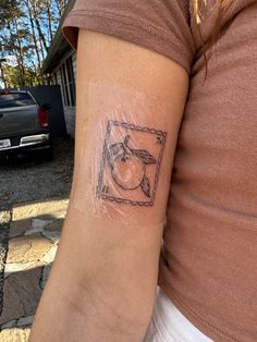 a woman's arm with a tattoo on it and an image of a bird