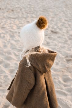 Winter Pom pom bonnet is our brand new and very fluffy design. It will be perfect for both toddlers and older children. The softest alpaca & silk yarn, double thread and beautiful faux fur pom pom - all this together makes this hat natural, extremely soft & warm and... beautiful :) Pom pom bonnet is available in sizes from 0 up to 5-6 years. Composition: 77% brushed alpaca, 23% silk (double thread) Season to wear: autumn/ winter 100% handknitted in Poland The cap is quite flexible, so the size i Unique Baby Gift, Kids Hat, Baby Layette, Hand Knit Hat, Unique Baby Gifts, Faux Fur Pom Pom, Silk Yarn, Knitted Hat, Neutral Baby