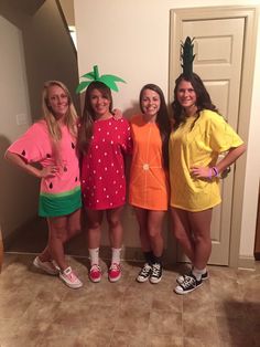 three girls in costumes standing next to each other