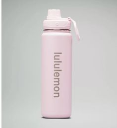 a pink insulated water bottle with the words inner city printed on it, sitting against a gray background