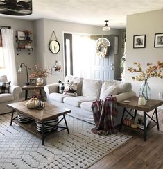 the living room is clean and ready to be used for fall decor purposes are pumpkins