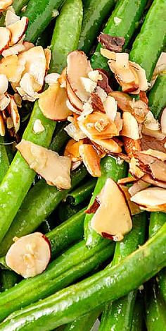 asparagus, almonds and green beans are piled on top of each other