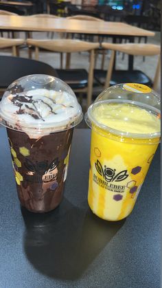 two drinks sitting next to each other on a table