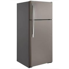 a silver refrigerator freezer sitting next to a white wall