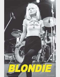 blondie on stage with drums in front of her and the words blondie written below