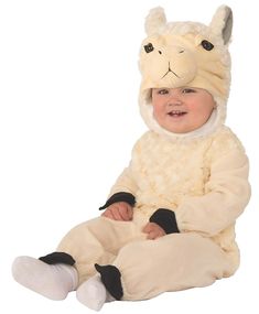 a baby in a llama costume sitting on the floor