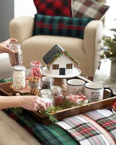 a tray filled with candy and marshmallows sitting on top of a couch