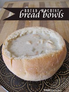 bread bowl filled with soup on top of a plate