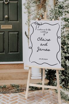 a sign that says welcome to the wedding of claire and james in front of a door