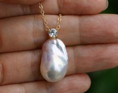 * Pearl Size: approx. 22mm x 14.5mm * Luster: High * Pearl Shape: Irregular * Pearl Surface: clean * Primary Color: White with pink tone * Necklace length: 16''-18'' * Material: Freshwater Pearl, sterling silver vermeil zirconia drop, 14k yellow gold filled chain Baroque Pearl Gemstone Jewelry For Wedding, Wedding Baroque Pearl Pendant Necklace, Baroque Pearl Necklaces For Wedding In Pear Shape, Pear-shaped Pearl Drop Necklace As Gift, Pear-shaped Pearl Necklace Gift, Wedding Baroque Pearl Necklace In Pear Shape, White Baroque Pearl Necklace, Gold Wedding Jewelry, Baroque Pearl Necklace