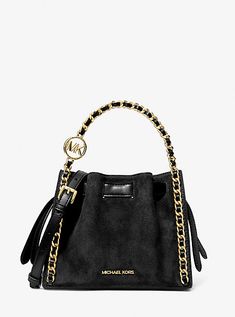 An everyday staple, our suede Mina bag will never go out of style. Defined by a compact silhouette and chain detailing for a touch of glam, it’s the perfect bag to throw over your shoulder for an easy transition from day to night. Suede Crossbody Shoulder Bag With Gold-tone Hardware, Evening Suede Bags With Detachable Strap, Chic Evening Suede Bags, Chic Suede Shoulder Bag With Metal Hardware, Chic Suede Bag With Metal Hardware, Michael Kors Crossbody Bag, Michael Kors Outlet, Michael Kors Crossbody, Bags Logo