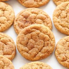 cookies are arranged in rows on a white surface