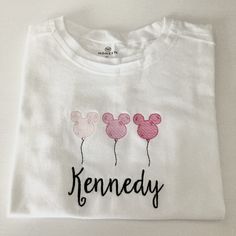 This short sleeve white tee is made of 100% organic cotton (I use Honest baby clothing brand) and is embroidered with your little one's name. Machine wash and dry on low. If you are wanting a different design, more wording, or a different clothing style, please send me a message so we can discuss the details. If you need this order rushed, please add these to your cart: https://www.etsy.com/listing/1043569716/rush-my-order-for-t-shirts?ref=shop_home_active_19&frs=1 Rush my order + Priority shipp Balloon Sketch, Disney Family Outfits, Mickey Mouse Balloon, Disneyland Sweatshirt, Disney Applique, Mickey Mouse Balloons, Honest Baby Products, Disney With A Toddler, Family Disney Trip