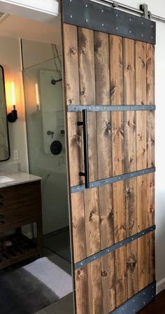 a bathroom with a sliding door in the middle and a sink on the other side