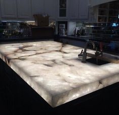 a kitchen counter top that is made out of marble