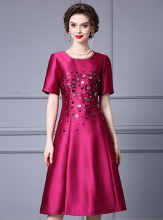 Presenting an exquisite mother of the bride dress that combines sophistication with modern design. The rich magenta color of this dress is both elegant and vibrant, perfect for a memorable occasion like a wedding. The bodice is beautifully embellished with sequins and beads, adding a glamorous sparkle that catches the light. The short sleeves and rounded neckline feature delicate details, enhancing the dress's overall appeal. The A-line silhouette flatters all body types, providing comfort and a Satin Short Sleeve, Sparkling Jewelry, Bow Wedding Dress, Chiffon Shorts, Magenta Color, Satin Short, Wedding Bows, Mother Of The Bride Dress, Rounded Neckline