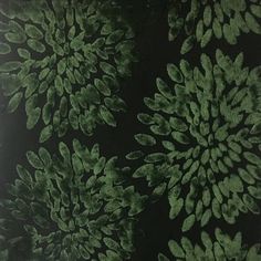 a black and green wallpaper with leaves on it