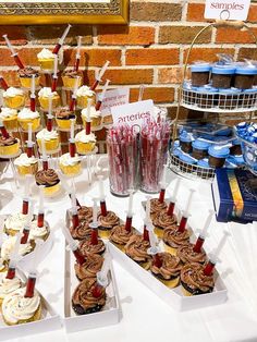 cupcakes and other desserts are displayed on a table