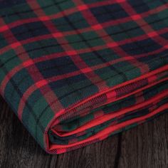 Dress a beautiful and cozy holiday tree with the Vickerman Highlands Plaid Christmas Tree Skirt. This 60" round skirt features a traditional red and green tartan plaid with a solid cotton duck cloth border. The fully lined design helps cushion and protect floors. The skirt features tie closures for easy placement and removal around the tree base. Dimensions: 60" W x 1" H x 60" D Weight: 3 lbs Color: Red, Green Material: Cotton Pieced with solid cotton duck cloth Fully lined Tie closure Made in I Plaid Christmas Tree Skirts, Tartan Plaid Tree Skirt, Tartan Plaid Christmas Tree Skirt, Vickerman Christmas Tree, Round Skirt, Plaid Christmas Tree Skirt, Tree Base, Plaid Christmas Tree, Textile Bag