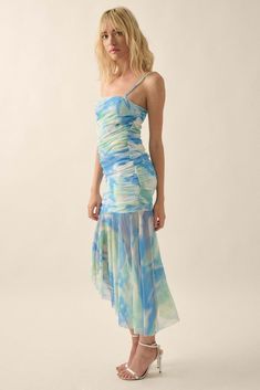 Tie-dye print mesh midi dress. Drop-waist design. Straight neckline. Ruched bodice. Sleeveless with adjustable cami straps. Low back. Partial thigh-length lining. Asymmetrical, raw-edge ruffle hem. Calf length. Fitted silhouette. 95% Polyester, 5% Spandex. Imported. Designed in LA. Model wears size S. Blue Fitted Mesh Dress For Spring, Fitted Blue Mesh Dress For Spring, Blue Mesh Dress For Summer, Fitted Blue Mesh Dress For Summer, Blue Sleeveless Summer Mesh Dress, Blue Sleeveless Mesh Dress For Spring, Summer Fitted Mesh Dress With Ruched Bodice, Chic Blue Mesh Dress For Spring, Summer Mesh Dress With Ruched Spaghetti Straps