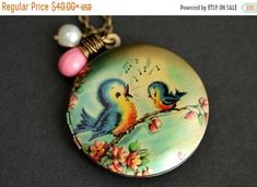 EASTER SALE Singing Bird Locket Necklace. Cartoon Bird Necklace. Bluebird Necklace with Pink Teardrop and Fresh Water Pearl Charm. Bronze Lo by TheTeardropShop from The Teardrop Shop. Find it now at https://ift.tt/31FidsS! Bird Locket, Blue Bird Art, Cartoon Bird, Blue Framed Art, Glitter Wall Art, Singing Bird