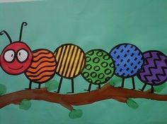 the very colorful caterpillars are on the tree branch painted with acrylic paint