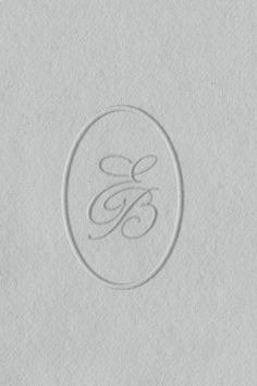 the monogrammed logo is shown in white paper