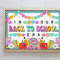 back to school sign hanging on the wall in front of a white brick wall with checkered border