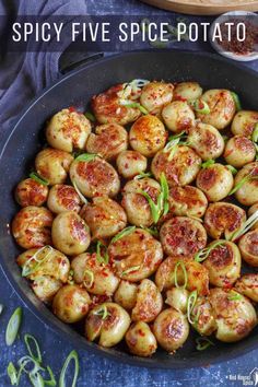 a pan filled with fried potatoes on top of a table