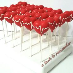 there are many heart shaped lollipops on sticks with the words taste to remover