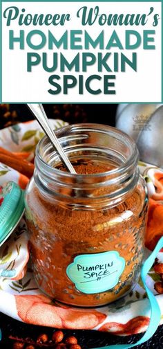 a jar filled with homemade pumpkin spice sitting on top of a table next to a spoon