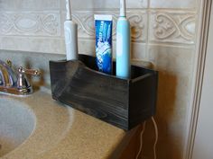 "This rustic spruce corded toothbrush holder features concealed cord storage to organize and hide unsightly electrical cords. Stores three toothbrushes with charging bases. Each compartment measures 2 3/4\" W x 3\" D to fit many styles of charging bases. If you're in doubt, please measure before ordering. If you would like to store more or fewer toothbrushes, let us know. We like custom orders! We will create the size you need! Use our Stain Selection Guide to choose your shade, then choose semi Hiding Electric Toothbrush Cords, How To Hide Electric Toothbrush, Electric Toothbrush Storage Hidden, Electric Toothbrush Storage, Electric Toothbrush Holder, Razor Holder, Toothbrush Holders, Toothbrush Storage, Cord Storage