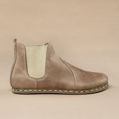 "Our Atlantis Handmade barefoot boots combine high-quality leather and traditional shoemaking skills. It is only through our know-how and belief in barefoot boots, a wealth of experience, and the best materials that we are able to create this unique and top-quality shoe. - Made in Turkey - 100% Natural - 100% Handmade - Ankle Boots - Hand-Stitched - Natural Leather Upper - Natural Leather Lining - Water Buffalo Leather Sole What are Barefoot Shoes? It is time to feel...EVERYTHING Barefoot walkin Vegetable-tanned Leather Chelsea Boots With Round Toe, Brown Closed Toe Boots With Stitched Sole, Brown Boots With Stitched Sole, Brown Leather Sole Slip-on Boots, Brown Slip-on Boots With Leather Sole, Beige Ankle-high Boots With Leather Sole, Leather Slip-on Desert Boots With Rubber Sole, Leather Slip-on Desert Boots, Leather Ankle Boots With Vibram Sole