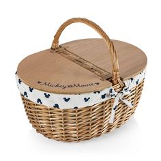 a wicker basket with a wooden lid and handle, decorated with mickey mouse fabric