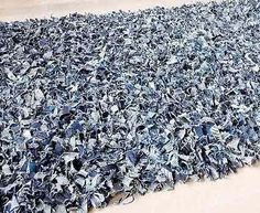 a large pile of blue and white items on top of a floor next to a wall