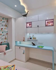 a white kitchen with blue counter tops and cabinets