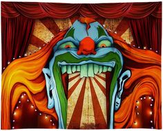 an image of a clown on stage with red curtains and lights in the back ground