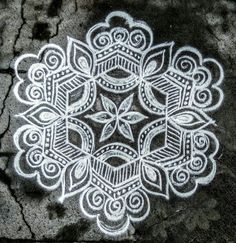 a drawing on the ground that looks like it has been made with chalk and white paint