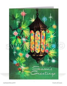 a christmas card with a lantern hanging from it's side on a green background