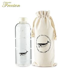 a bottle with a drawstring bag next to it and an empty glass bottle