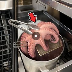 an octopus being cooked in the oven with a spatula on it's head