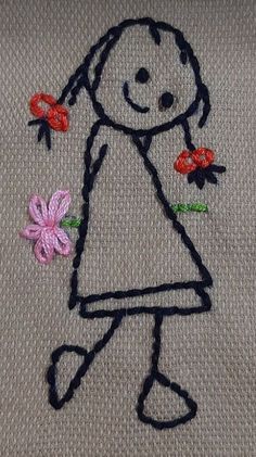 a drawing of a girl with flowers in her hand on a piece of cloth that has been embroidered onto it