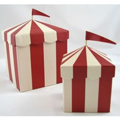 two red and white striped boxes sitting next to each other