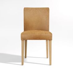 a brown chair sitting on top of a white floor