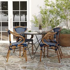 two chairs and a table on a patio