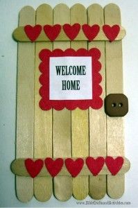 a wooden door with hearts on it that says welcome home